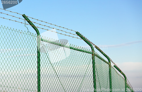 Image of Mesh fence with barbed wire
