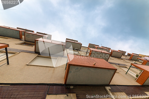 Image of Balconies Old Apartments on cloud sky background