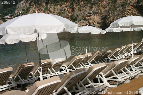 Image of Beach chairs and parasols