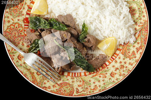 Image of Chilli beef with basil over black