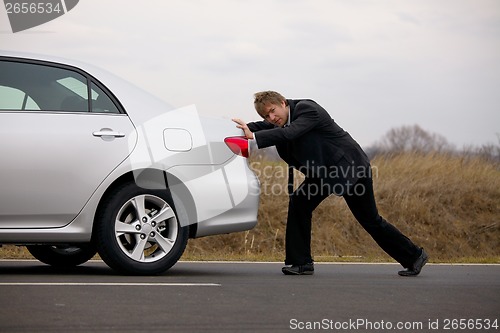 Image of Pushing car