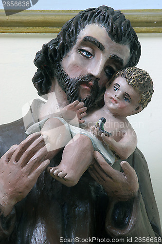Image of Saint Joseph holding baby Jesus