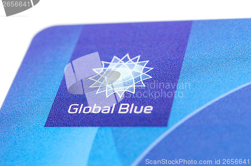 Image of Close up corner of plastic card "Global Blue" with logo