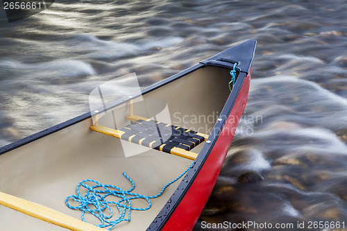 Image of red canoe stern with a rope