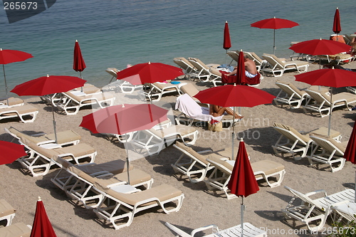 Image of Beach with red parasols, Monaco