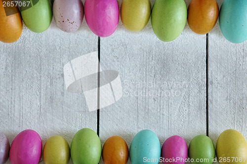 Image of Easter or Spring Themed Background of Old Wood and Colored Eggs 