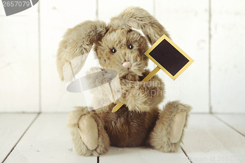 Image of Teddy Bear Like Home Made Bunny Rabbit on Wooden White Backgroun