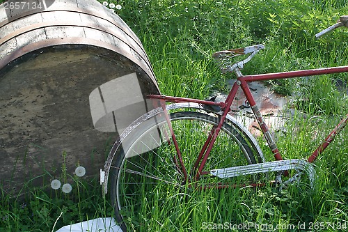 Image of Red bike and barrel