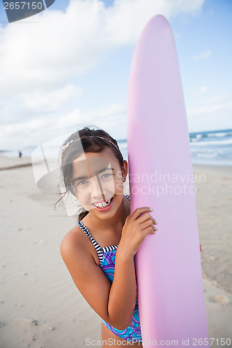 Image of Happy young girl with surfboard