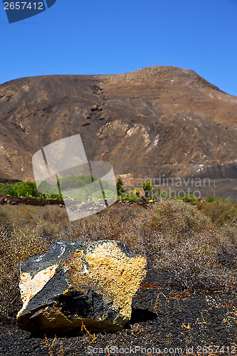 Image of  volcanic timanfaya  rock stone sky  hill and s