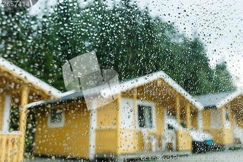 Image of Camping cabins in heavy rain