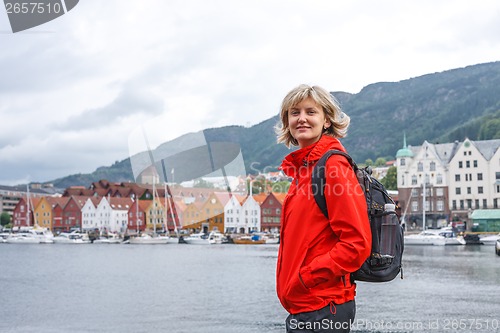 Image of Woman tourist against cityscape of Bergen