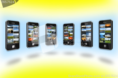 Image of Modern mobile phones with different images