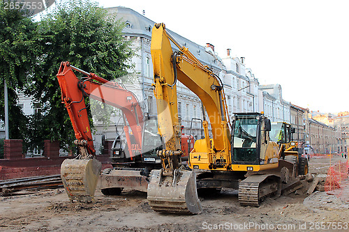 Image of two modern excavators working on the Lvov's street