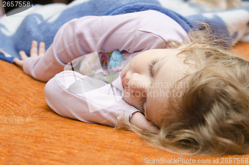 Image of Girl sleeping on the couch