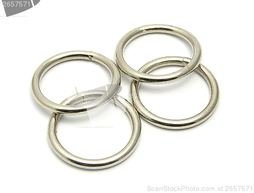 Image of Four rings of metal arranged