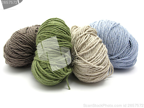 Image of Four lying balls of wool