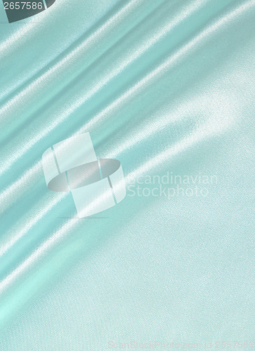 Image of Smooth elegant blue silk as background 