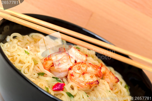 Image of Shrimp and noodle soup bowl with chopsticks