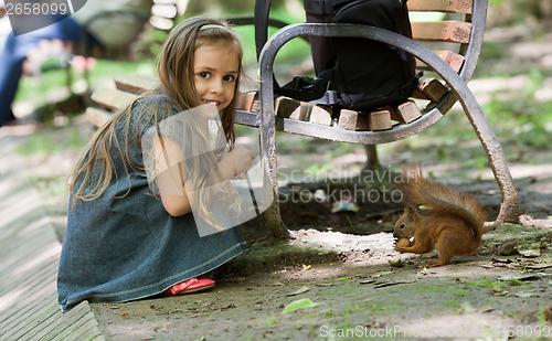 Image of Little girl with squirrel