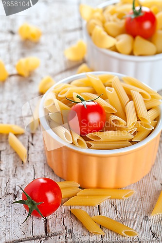 Image of uncooked pasta and cherry tomatoes