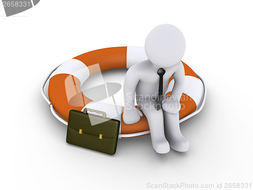 Image of Businessman sitting on lifebuoy