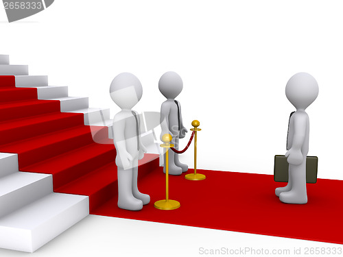 Image of Businessman in front of stairs and two others are blocking his w