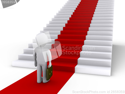 Image of Businessman in front of stairs with red carpet