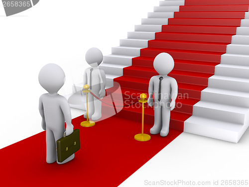 Image of Businessman is refused access to stairs with red carpet