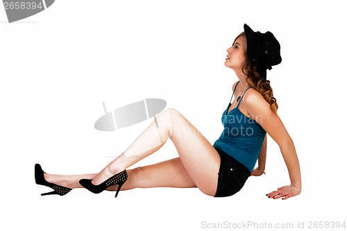 Image of Girl sitting on floor.