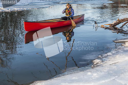Image of canoe paddling in winter