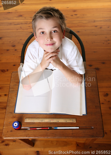 Image of Child at desk with open book