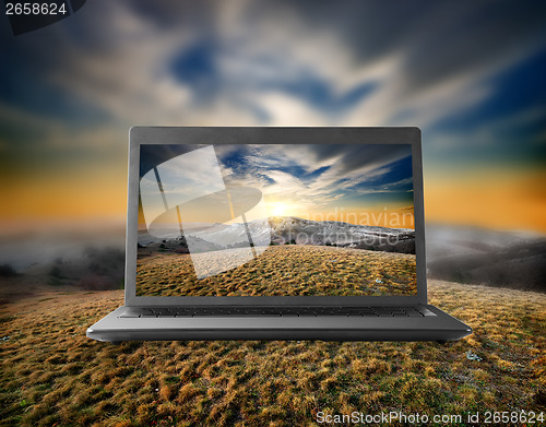 Image of Mountains on a display of notebook