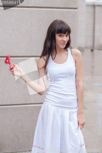 Image of Pretty girl with red beads