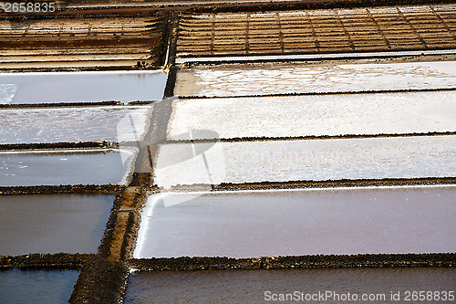 Image of salt in  lanzarote spain musk pond rock stone sky 