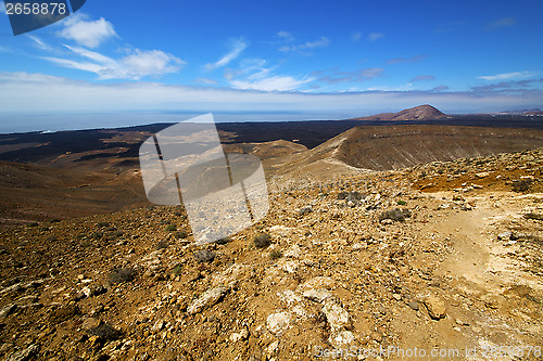 Image of in los volcanes volcanic timanfaya  rock stone sky 