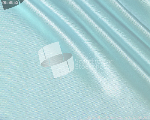 Image of Smooth elegant blue silk as background 