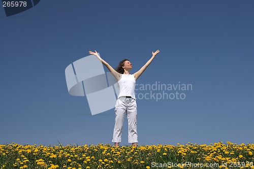 Image of Young woman greets the sun