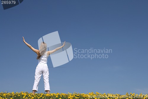 Image of Young woman exercising outdoors