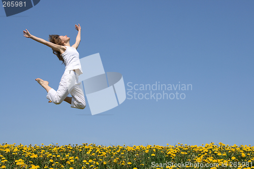 Image of Young woman in a beautiful jump