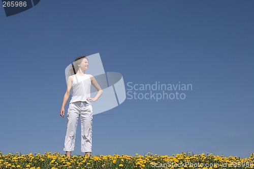 Image of Young woman in flowering field