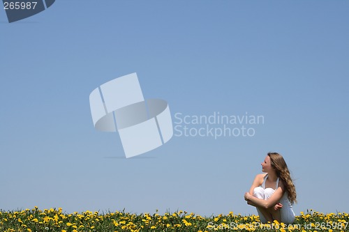 Image of Young woman enjoying fresh air and sun