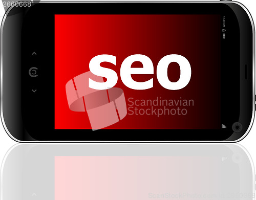 Image of Web development concept: smartphone with word SEO on display