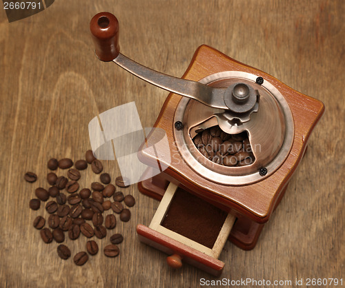 Image of vintage coffee grinder and beans