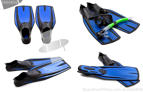 Image of Set of blue swim fins, mask, snorkel for diving with water drops