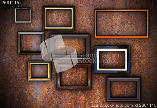 Image of rusty wall full of empty frames