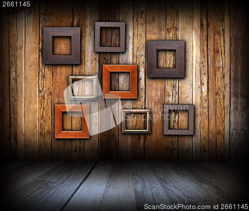 Image of abstract frames on wooden wall