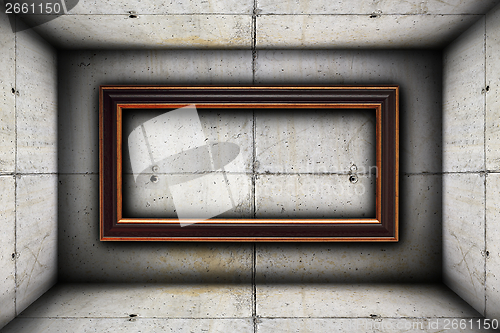 Image of big frame on concrete wall