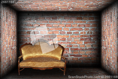 Image of sofa in brick finished room