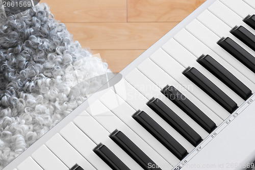 Image of Close-up of electric piano and chair